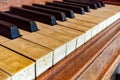 real elephant ivory piano keys on old wooden grand piano black and white keys with dirt, sweat and finger oils pattern detail late Royalty Free Stock Photo