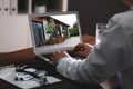 Real estate agency online service. Doctor choosing new house via laptop Royalty Free Stock Photo