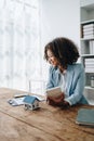 Real estate agent, African American businesswoman Africans use smartphone and calculators to offer mortgages to their Royalty Free Stock Photo