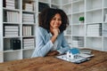 Real estate agent, African American businesswoman Africans use smartphone and calculators to offer mortgages to their Royalty Free Stock Photo