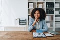 Real estate agent, African American businesswoman Africans use smartphone and calculators to offer mortgages to their Royalty Free Stock Photo