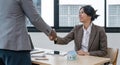 Real estate agent African American handshake to customer business woman asian to congratulate after sign a contract to Royalty Free Stock Photo