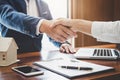 Real estate agent and customers shaking hands together celebrating finished contract after about home insurance and investment lo Royalty Free Stock Photo