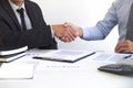 Real estate agent and customers shaking hands together celebrating finished contract after about home insurance and investment Royalty Free Stock Photo