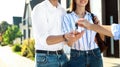 Real estate agent giving house keys to young couple, closeup Royalty Free Stock Photo