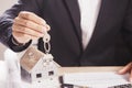 Real estate agent handing over house keys. Royalty Free Stock Photo