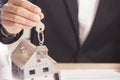 Real estate agent handing over house keys. Royalty Free Stock Photo