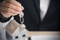 Real estate agent handing over house keys. Royalty Free Stock Photo