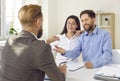 Real estate agent giving happy young family keys to their new house or apartment Royalty Free Stock Photo