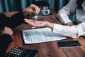 Real estate agent hand over key to buyer as a symbol of ownership. Enthusiastic Royalty Free Stock Photo