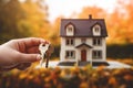 Real estate agent holding house key in hand. Real estate concept. Ai generative Royalty Free Stock Photo