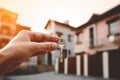 Real estate agent holding house key in hand. Real estate concept. Ai generative Royalty Free Stock Photo