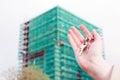 A real estate agent holding keys to a new apartment in her hands. Royalty Free Stock Photo