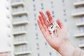 A real estate agent holding keys to a new apartment in her hands. Royalty Free Stock Photo