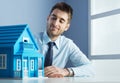 Real estate agent with model house Royalty Free Stock Photo