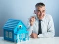 Real estate agent with model house Royalty Free Stock Photo