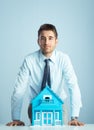 Real estate agent with model house Royalty Free Stock Photo