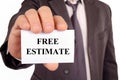 Free estimate written on a card held by a man