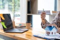 A real estate agent is preparing to deliver the house and keys to the customer who signed the purchase contract inside the real Royalty Free Stock Photo