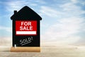 Real estate agent for sale sign and chalk blackboard Royalty Free Stock Photo