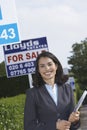 Real Estate Agent By For Sale Sign Outside House Royalty Free Stock Photo