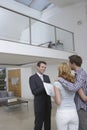 Real Estate Agent Showing Couple New Home Royalty Free Stock Photo