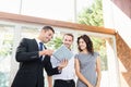 Real-estate agent showing couple new home Royalty Free Stock Photo