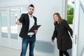 real estate agent showing house to female customer Royalty Free Stock Photo