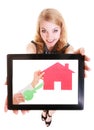 Real estate agent showing paper house on tablet. Royalty Free Stock Photo