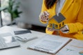 A real estate agent sits in her office, The salesperson is presenting what the home the customer is about to buy looks like, The Royalty Free Stock Photo