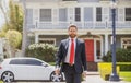 Real estate agent welcoming visitors near new house. Portrait of realtor man. Royalty Free Stock Photo