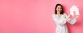 Real estate. Beautiful asian woman demonstrating paper house model, looking at camera confident, advertising home for Royalty Free Stock Photo