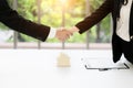 Real estate broker and customer shaking hands after signing a contract: real estate, home loan and insurance concept Royalty Free Stock Photo