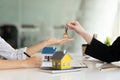 Real estate broker and customer shaking hands after signing a contract: real estate, home loan and insurance concept Royalty Free Stock Photo