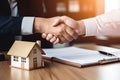 Real estate broker shaking hands with buyer after signing the contract. Generative AI