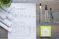 Real Estate concept. Architectural project, blueprints, blueprint rolls and divider compass on vintage wooden table Royalty Free Stock Photo