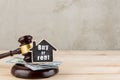 Real estate concept auction gavel and little house with inscription Buy or Rent Royalty Free Stock Photo