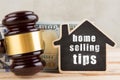 Real estate concept - Home selling tips, gavel and house model Royalty Free Stock Photo