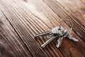 Real estate concept, Key ring and keys on wooden background Royalty Free Stock Photo