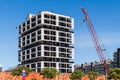 Real estate development concept. Low angle view of a new high-rise housing complex being built. Modern architecture facade with Royalty Free Stock Photo