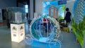 Real estate exhibition in expo centre. Stand decor from fairy carriage decorated with flowers. Presentation of residential buildin