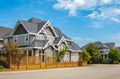 Real Estate Exterior Front House with shingle roof.Edge of roof shingles on top of a house dark asphalt tiles on a roof