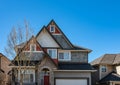 Real Estate Exterior Front House on a sunny day. Big custom made luxury house. A perfect neighborhood. Houses in suburb Royalty Free Stock Photo