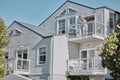 Real estate, house and couple relax on balcony of their dream home, happy, proud and laughing. Property, family and Royalty Free Stock Photo