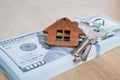 Real estate investing concept. American dollar, cash or housing. Keys close-up Royalty Free Stock Photo