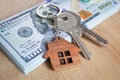 Real estate investing concept. American dollar, cash and housing. Keys close-up Royalty Free Stock Photo