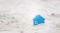 Real estate investment with Small home on sand. Royalty Free Stock Photo