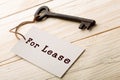 real estate lease concept - old key with tag Royalty Free Stock Photo