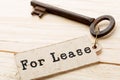 real estate lease concept - old key with tag Royalty Free Stock Photo