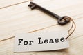 real estate lease concept - old key with tag Royalty Free Stock Photo